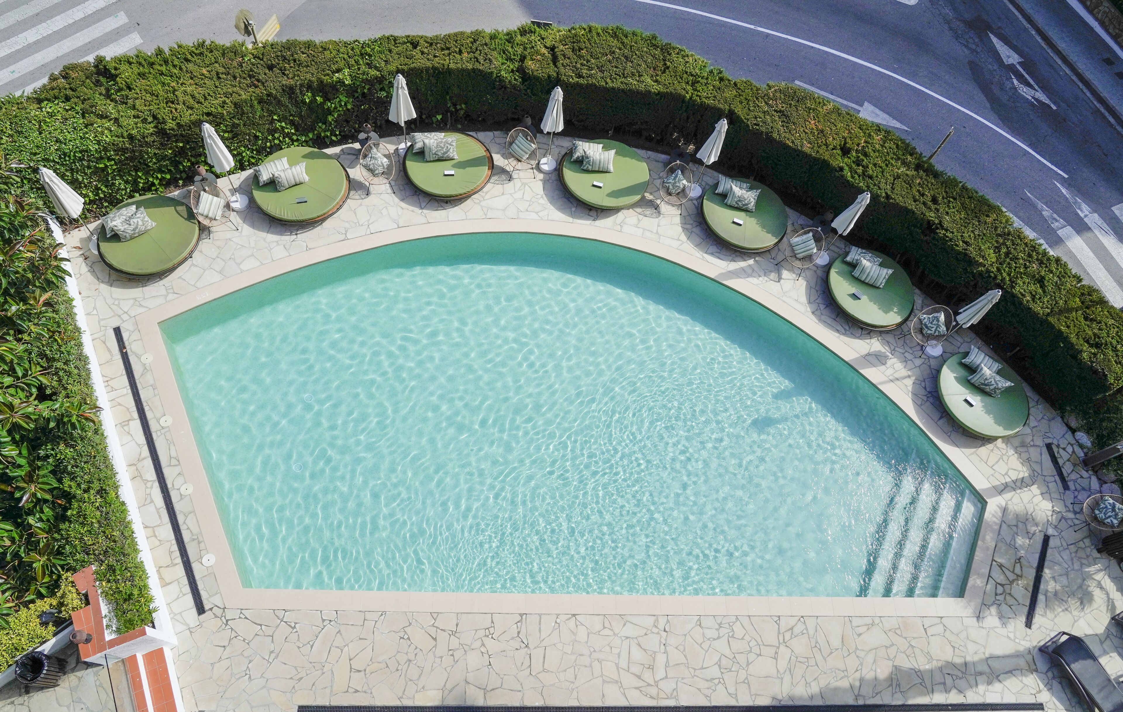 outdoor pool, open 10:00 am to 7:00 pm, pool umbrellas, pool loungers