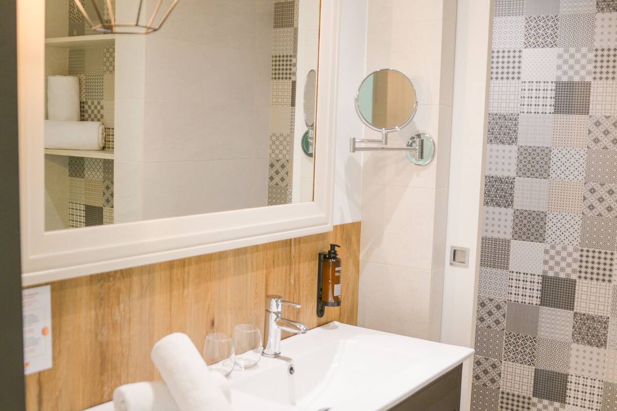 shower, eco-friendly toiletries, hair dryer, towels