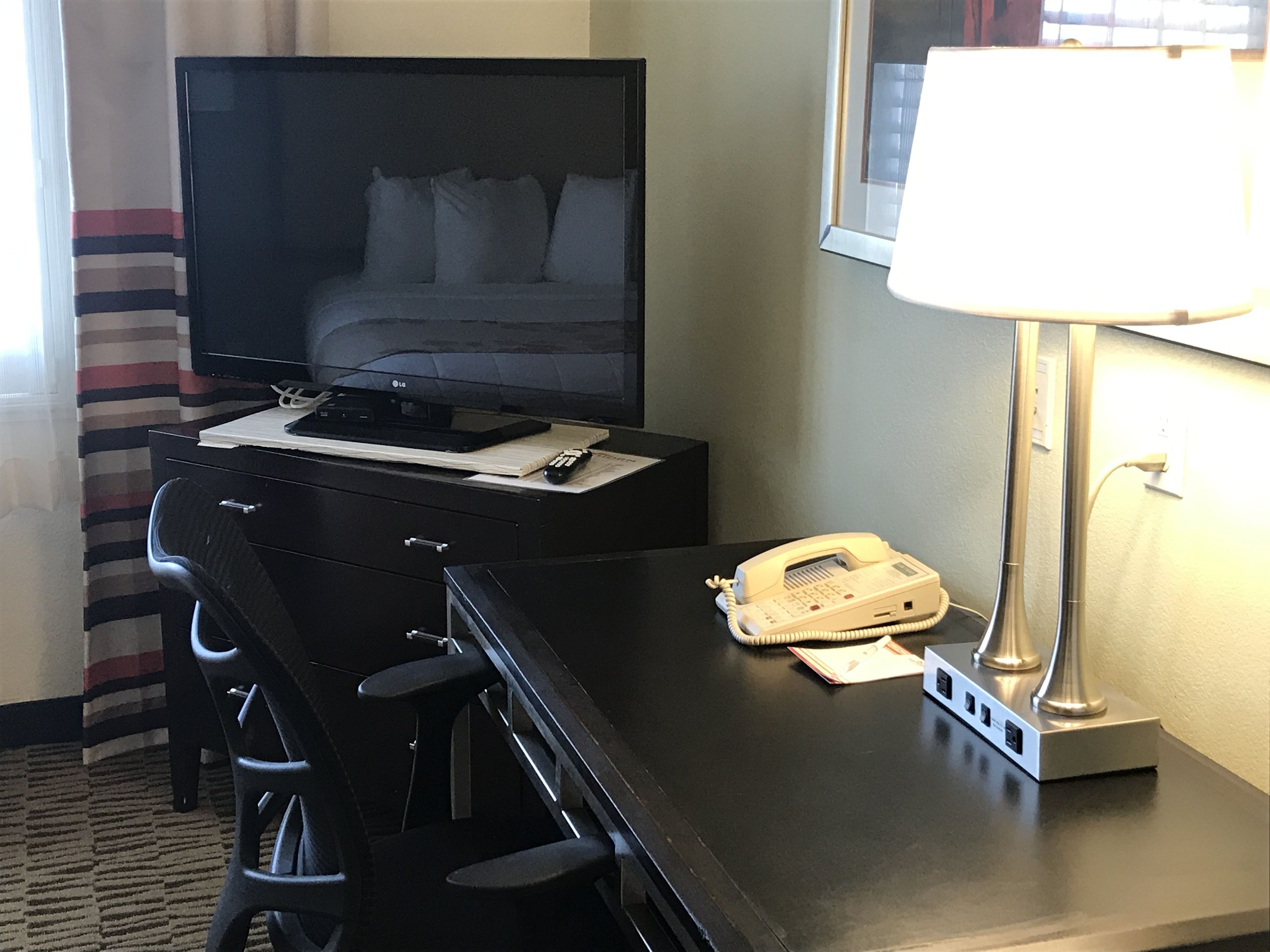 premium bedding, pillow-top beds, desk, blackout curtains