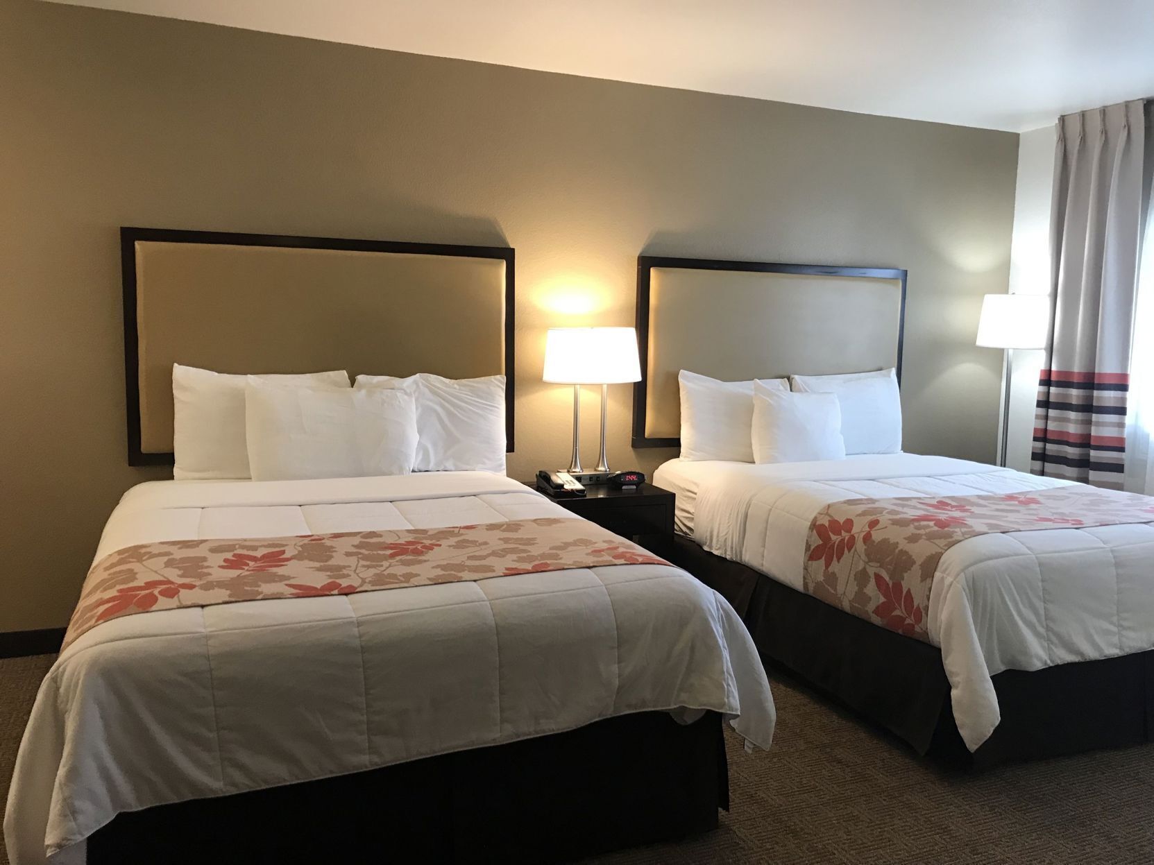 Premium bedding, pillowtop beds, desk, blackout drapes