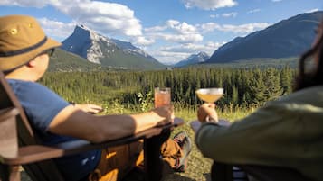 Guests can enjoy a peaceful moment amidst breathtaking mountain views and lush forest surroundings.