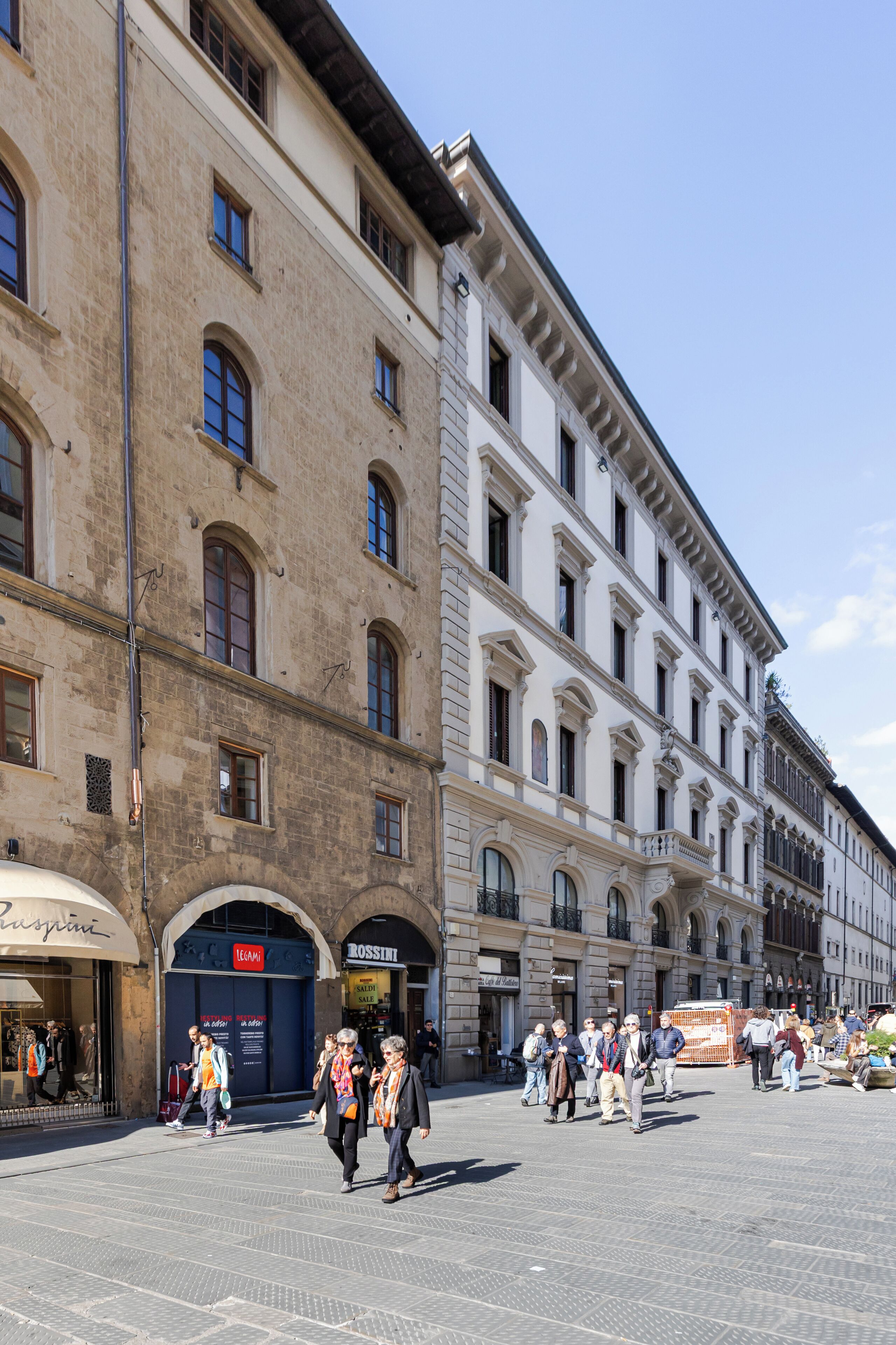 A historic building with arched windows and a central entrance.