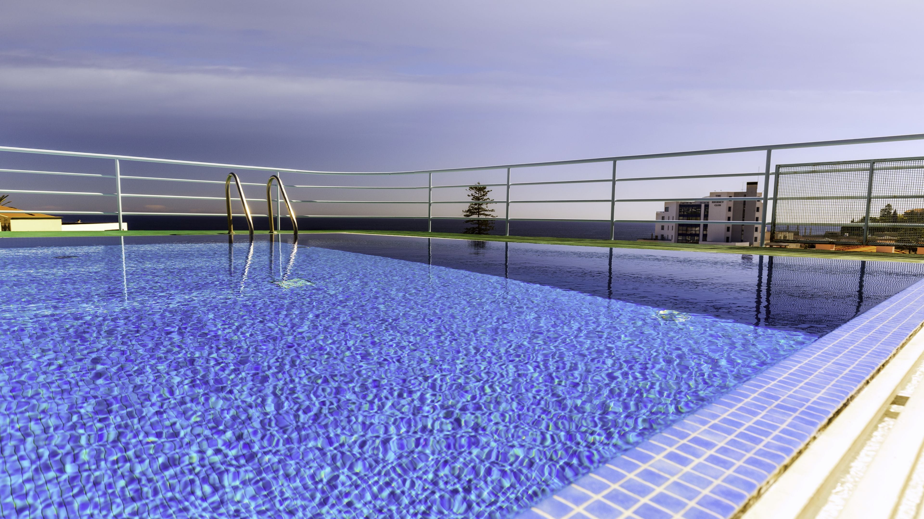 Outdoor pool, open 9:30 AM to 7:30 PM, pool loungers