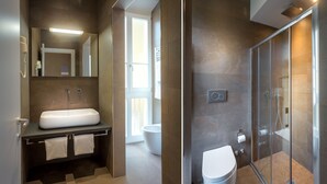 A modern bathroom with a large sink, a glass shower enclosure, and a visible toilet. - Tourist House Liberty (Florence)