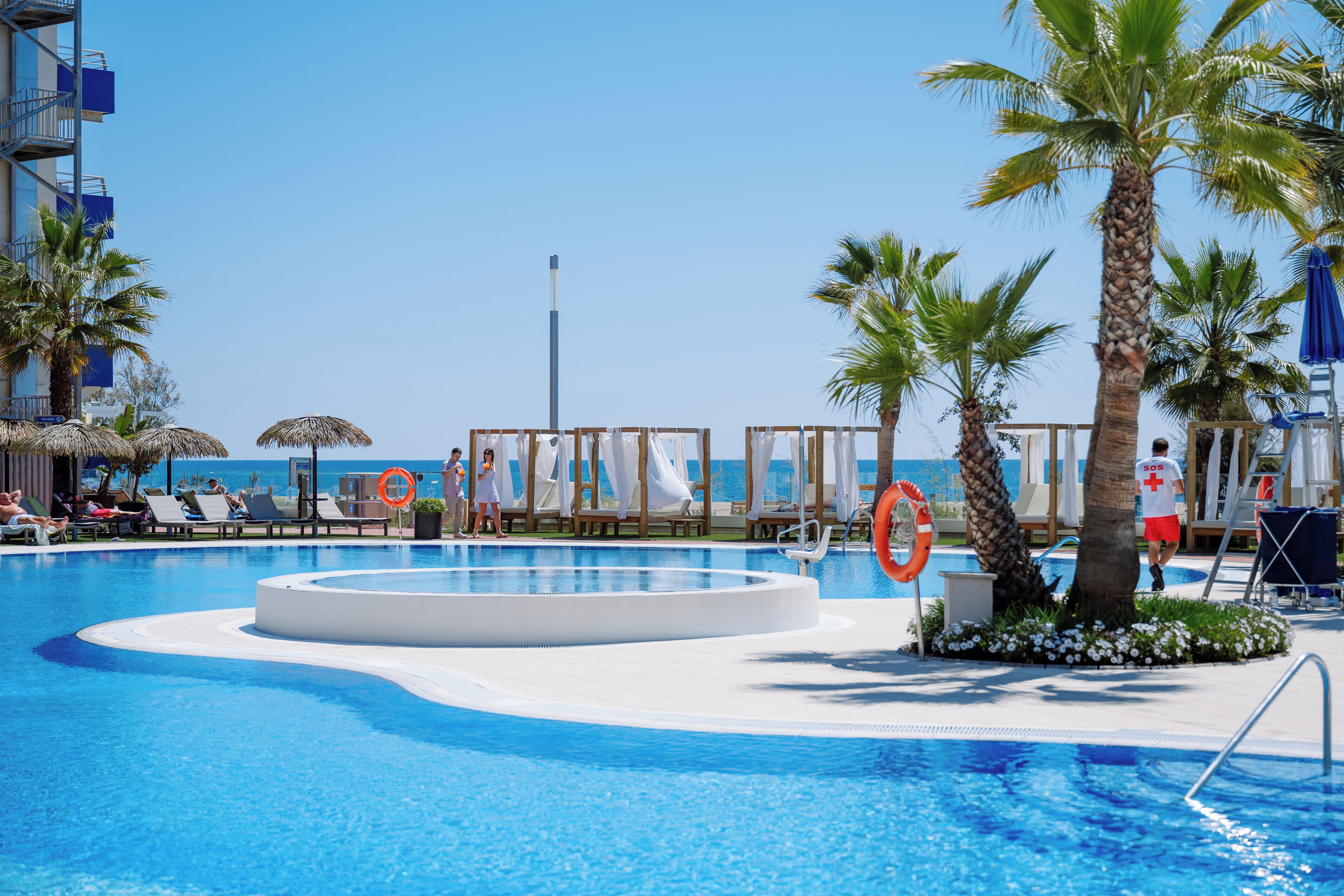 Outdoor pool, pool umbrellas, sun loungers