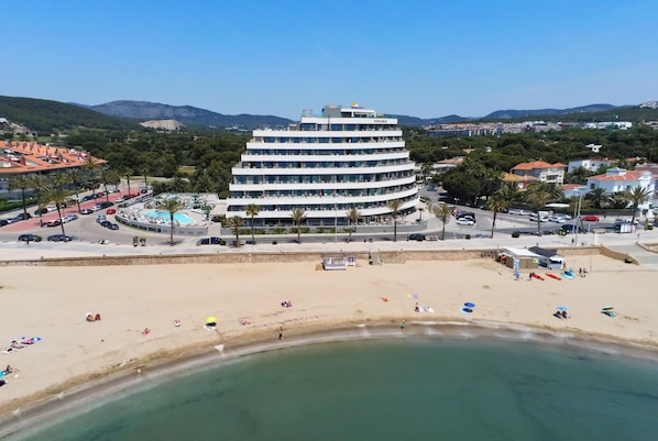 On the beach, sun-loungers, beach umbrellas, beach towels
