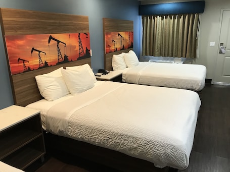 Room. | Premium bedding, desk, blackout curtains, iron/ironing board