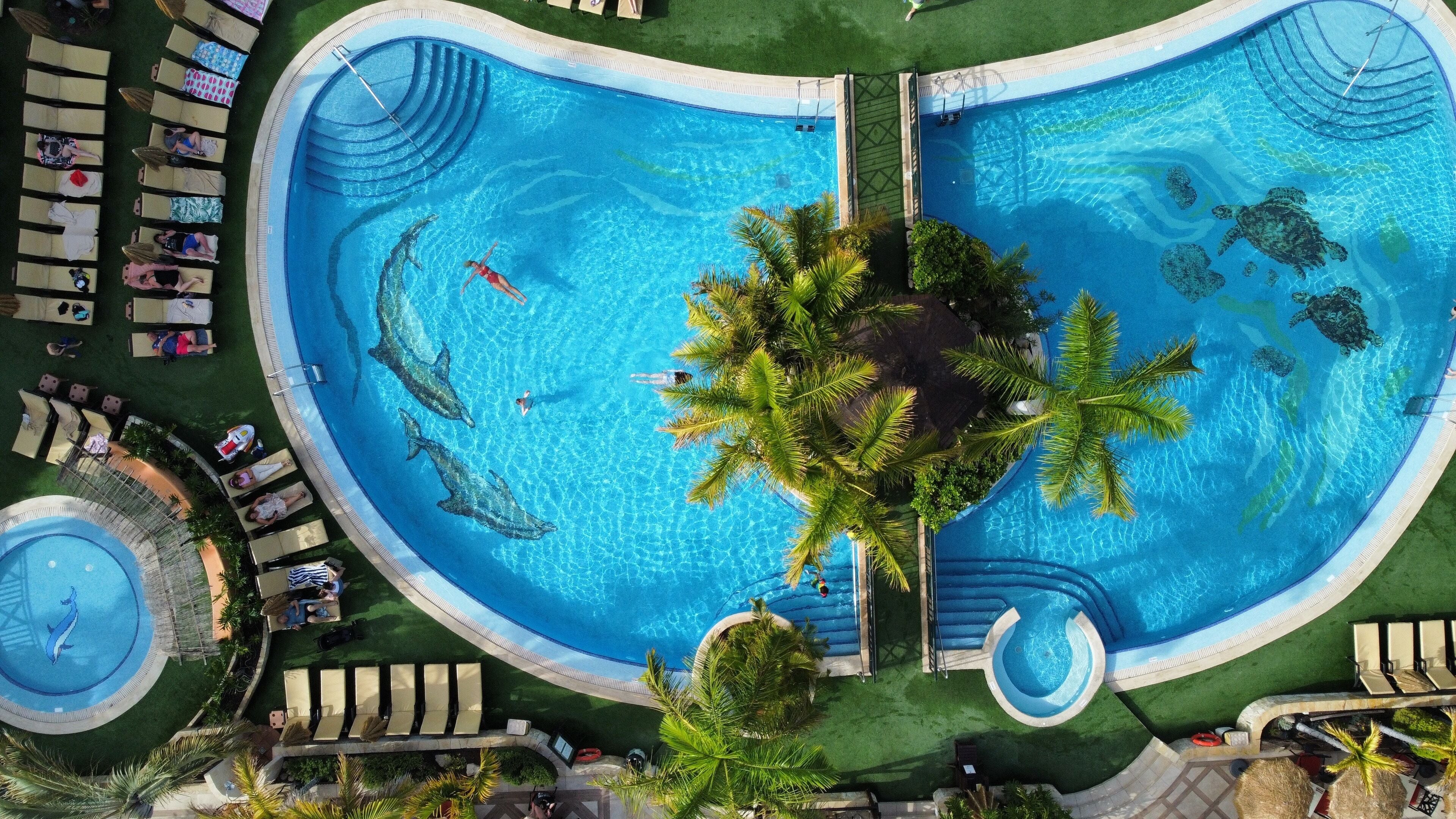 2 outdoor pools, pool umbrellas, pool loungers