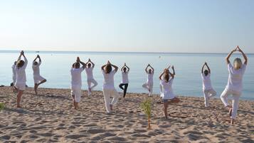 Guests can enjoy serene yoga sessions on the beach, surrounded by the ocean.