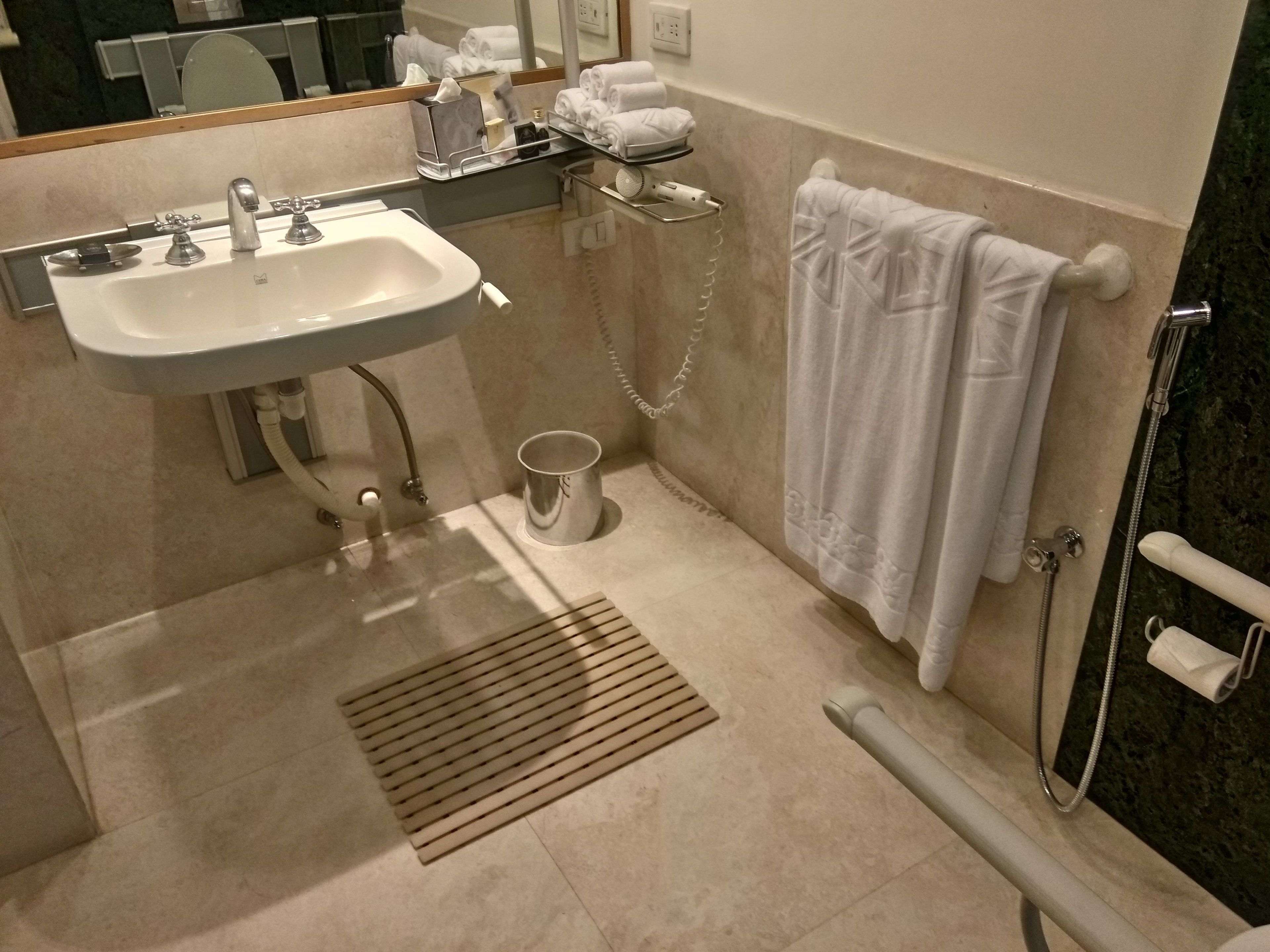 superior room, 1 queen bed, accessible | bathroom | hair dryer, slippers, towels