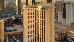 A high-rise hotel with a central courtyard, multiple floors, and a prominent sign. - Marriott's Grand Chateau (Las Vegas)