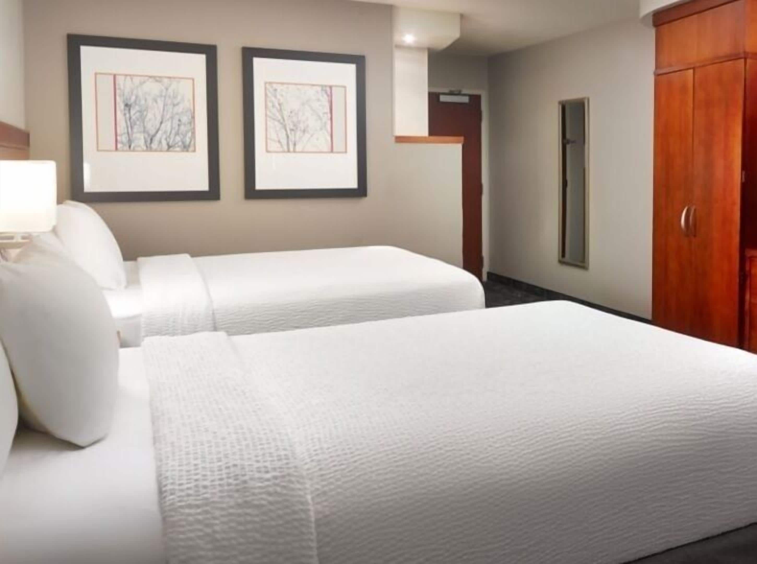 Premium bedding, down comforters, desk, laptop workspace