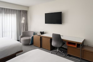 Premium bedding, down comforters, memory foam beds, in-room safe