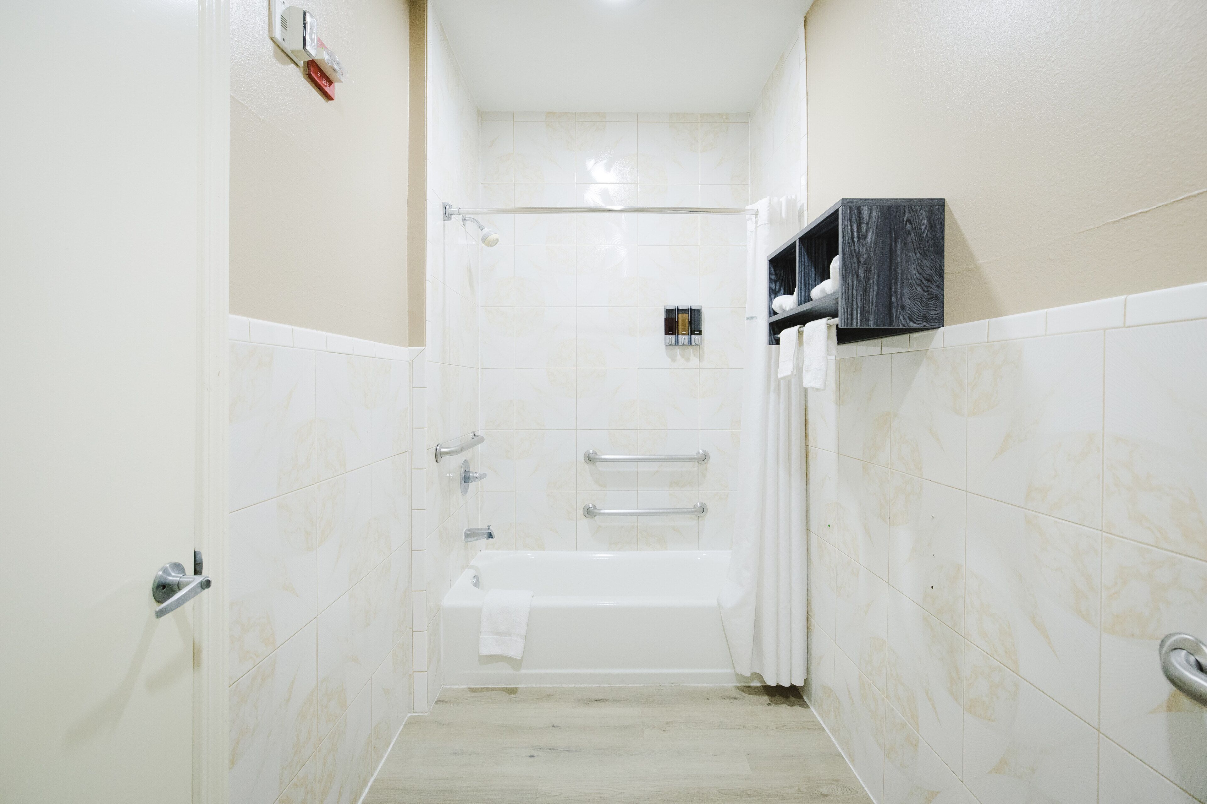 A bathroom with a bathtub, a shower, and a toilet.