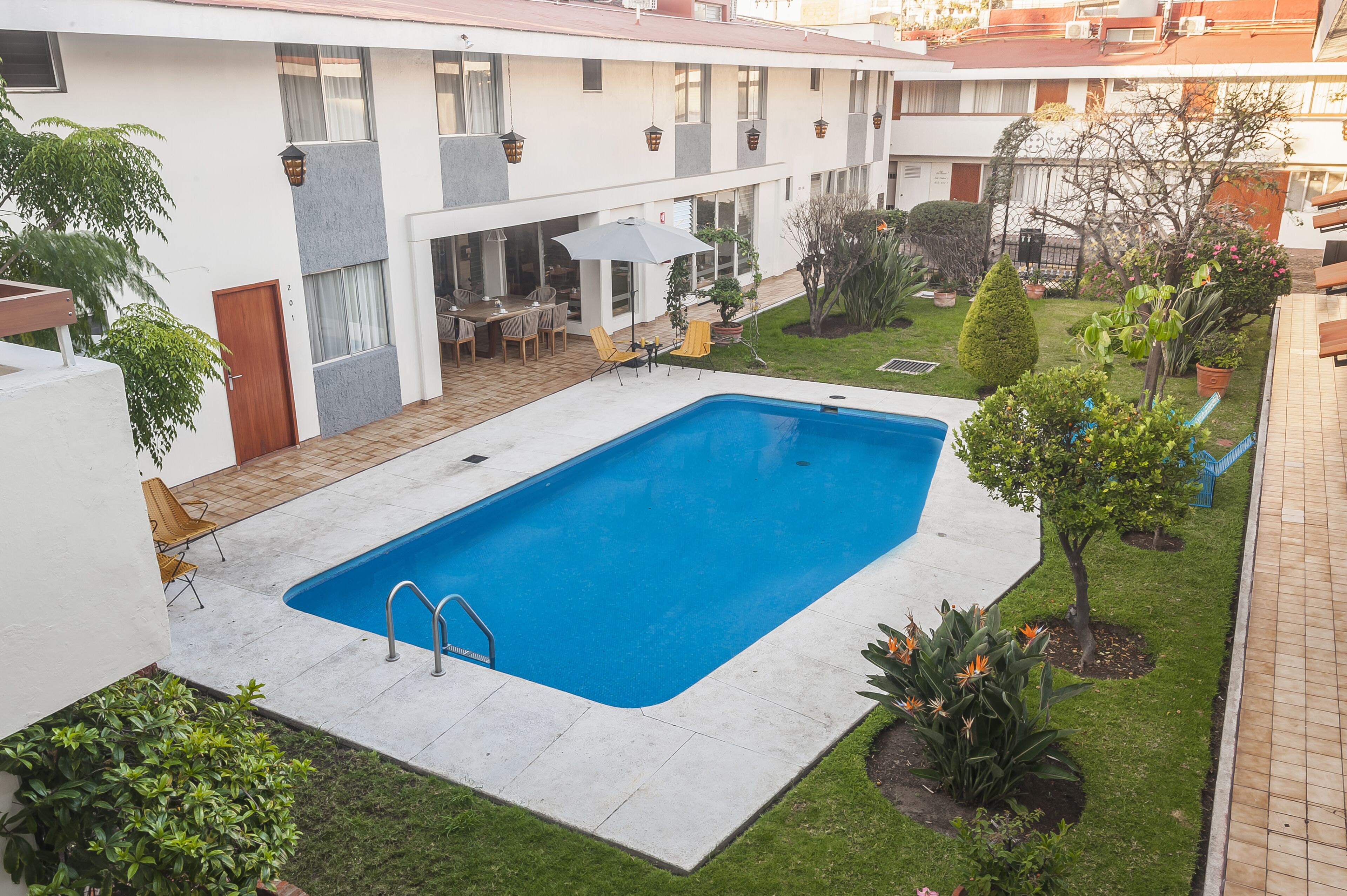 Outdoor pool, open 9:00 AM to 9:00 PM, pool umbrellas, sun loungers