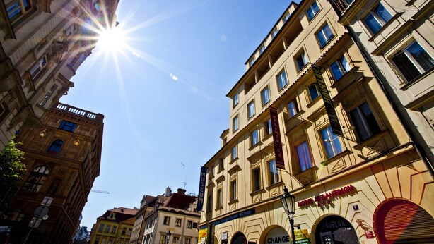 A hotel with a classic architectural style, featuring multiple stories and a prominent entrance. - Hotel Melantrich (Prague)