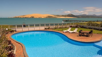 Outdoor pool, open 8:00 AM to 7:00 PM, pool umbrellas, pool loungers