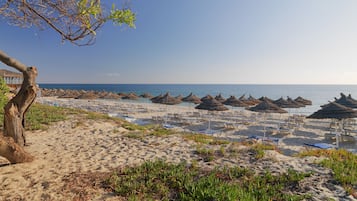 On the beach, sun loungers, beach umbrellas, beach towels
