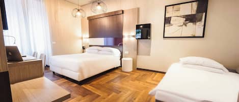 Triple Room | Minibar, in-room safe, desk, iron/ironing board