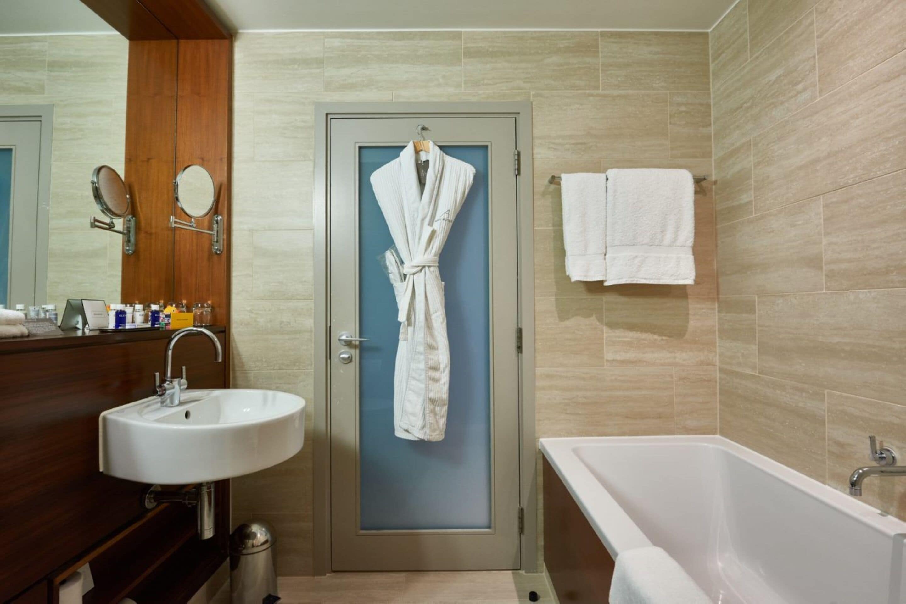 designer toiletries, hair dryer, bathrobes, slippers