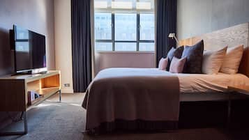 Habitación Deluxe | Ropa de cama hipoalergénica y caja de seguridad en la habitación