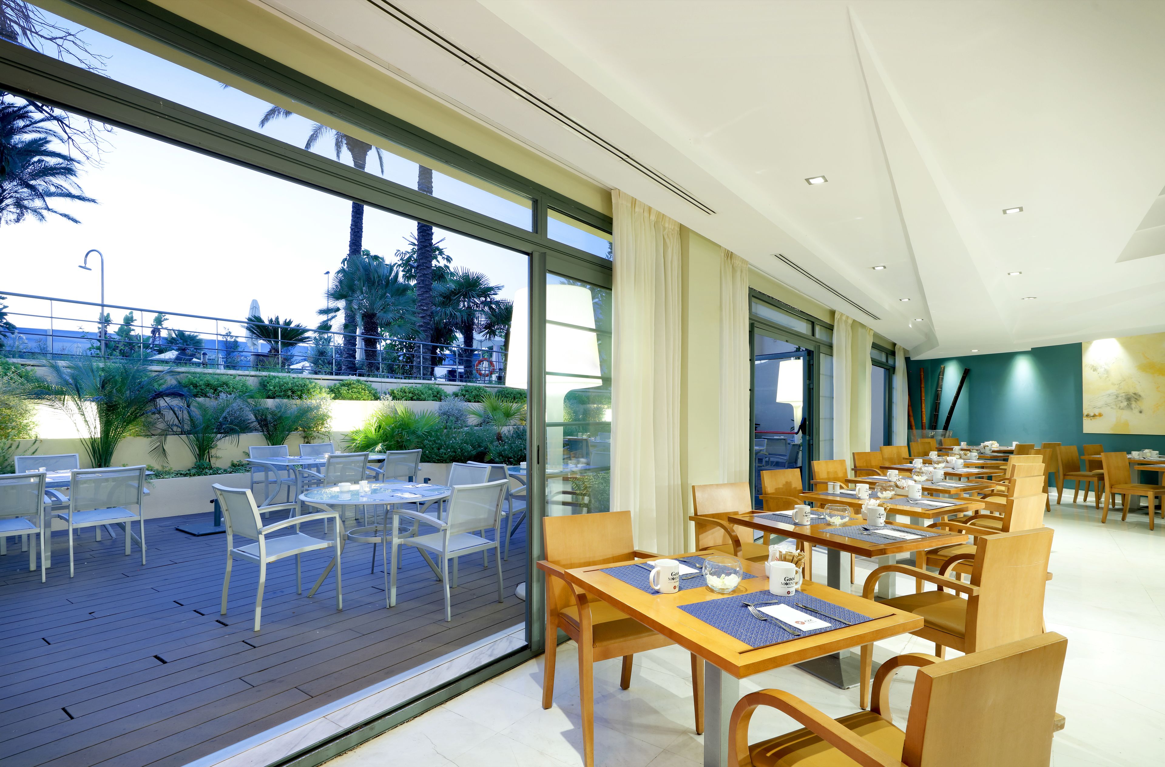 A restaurant with outdoor seating and indoor dining.