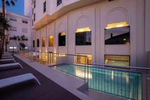 Indoor pool, outdoor pool, open 10:00 AM to 8:00 PM, pool umbrellas