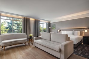 Junior Suite, 1 King Bed | Living area | 27-inch flat-screen TV with cable channels