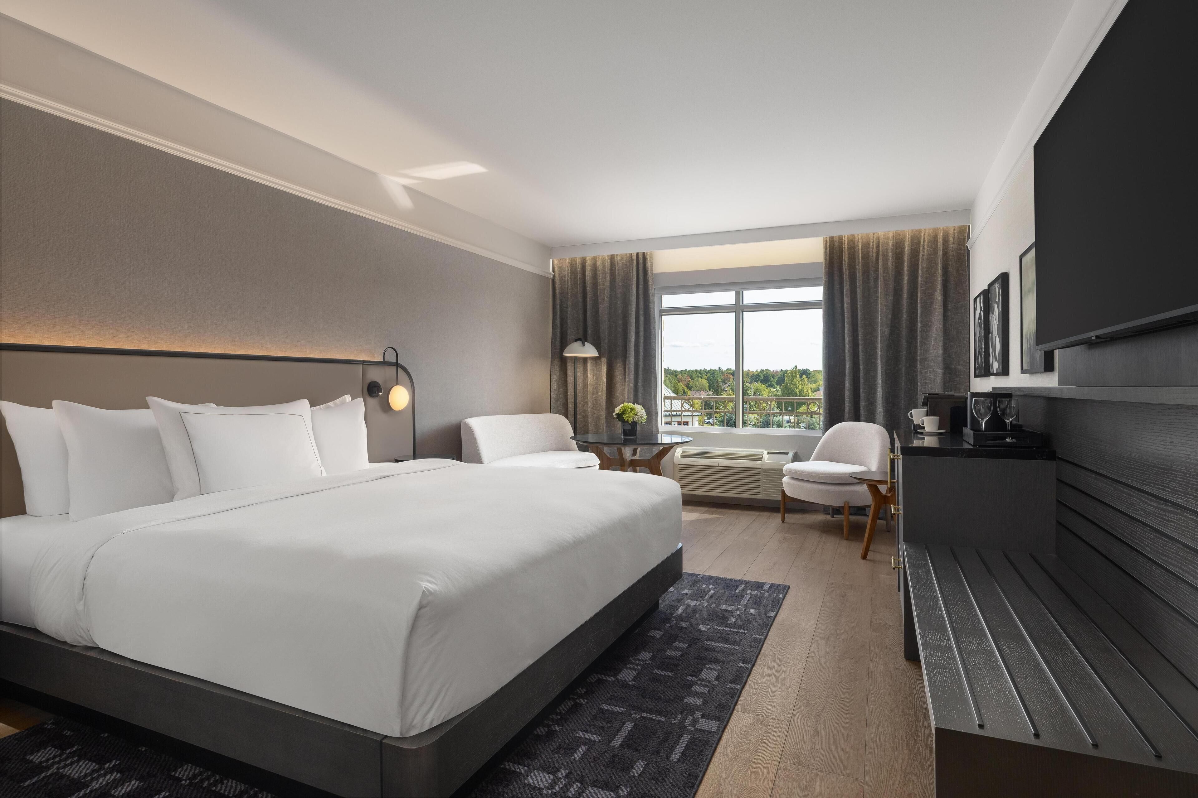 Hypo-allergenic bedding, down duvets, pillow-top beds, in-room safe