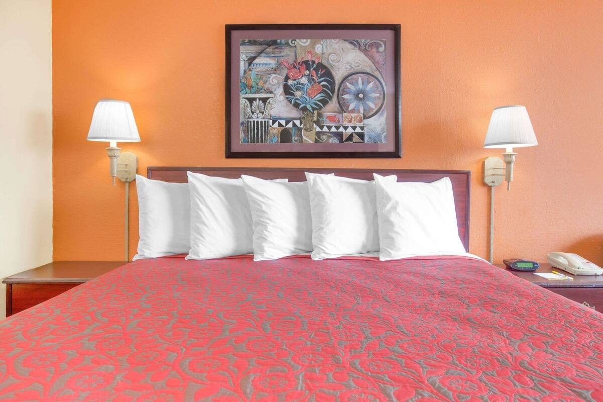 Desk, laptop workspace, blackout drapes, iron/ironing board