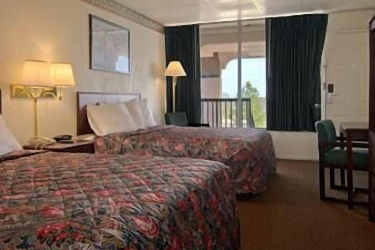 Desk, laptop workspace, blackout drapes, iron/ironing board