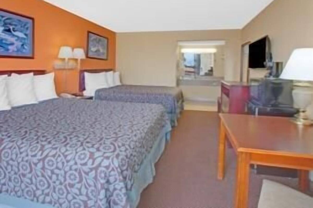 Desk, laptop workspace, blackout drapes, iron/ironing board