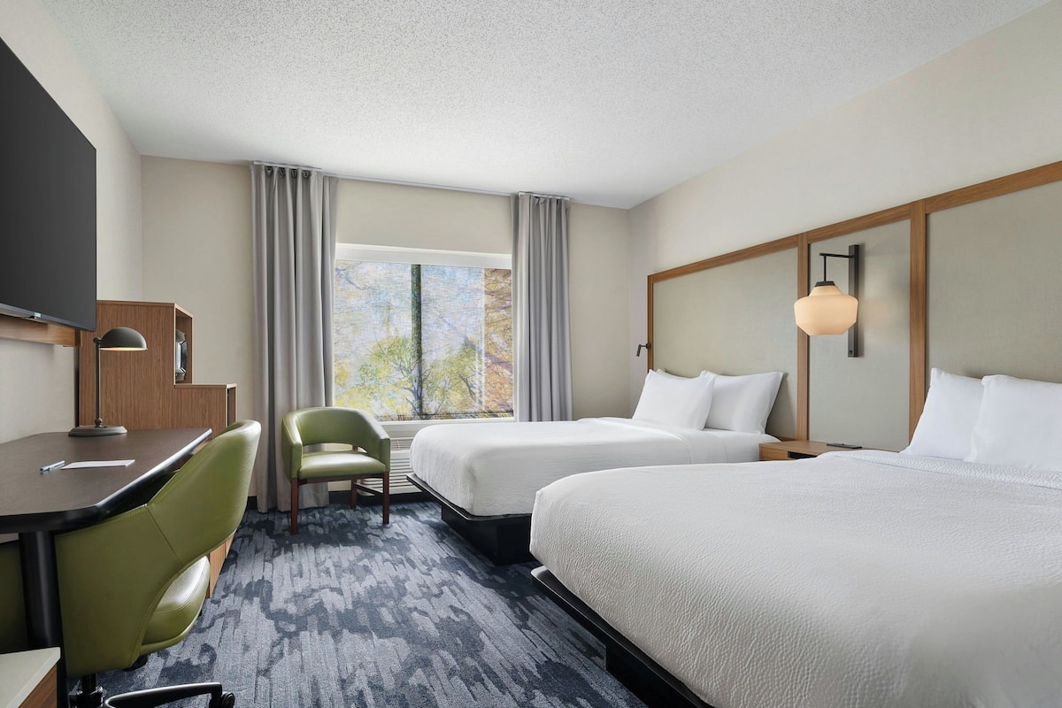 Premium bedding, desk, laptop workspace, soundproofing