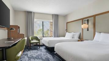 Premium bedding, desk, laptop workspace, soundproofing