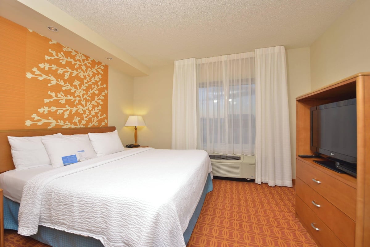 Premium bedding, desk, laptop workspace, soundproofing