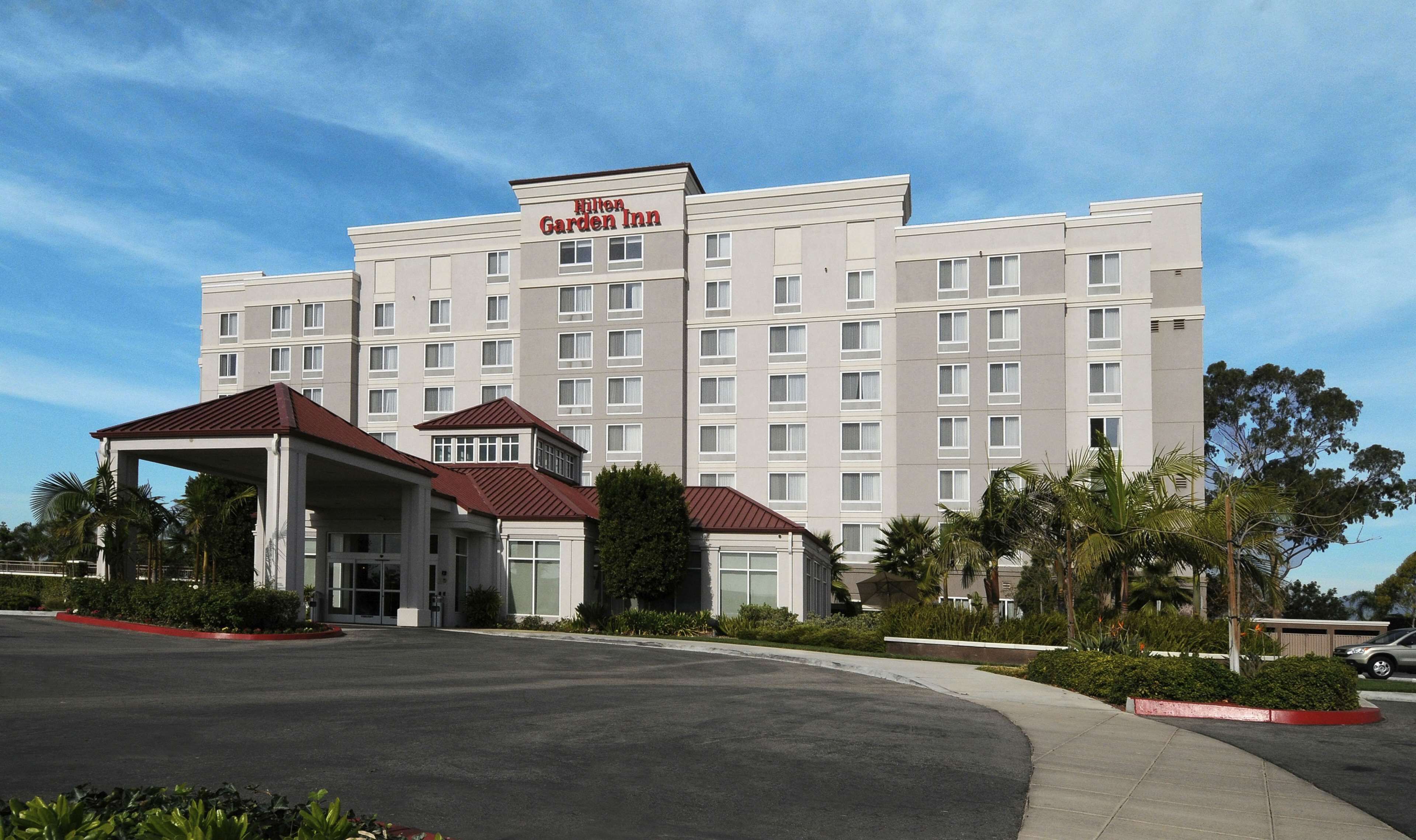 A Hilton Garden Inn with a modern facade, multiple floors, and a covered entrance area.