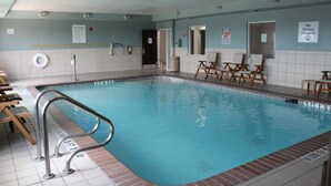 A swimming pool with a lifeguard chair, a pool rule sign, and a no diving allowed sign. - Holiday Inn Express & Suites San Antonio-West-SeaWorld Area by IHG (San Antonio)