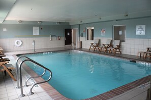 A swimming pool with a lifeguard chair, a pool rule sign, and a no diving allowed sign. - Holiday Inn Express & Suites San Antonio-West-SeaWorld Area by IHG (San Antonio)