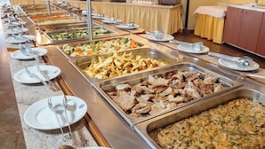 A buffet with various food options including meats, salads, and other dishes. - Resort Fontana (Jelsa)
