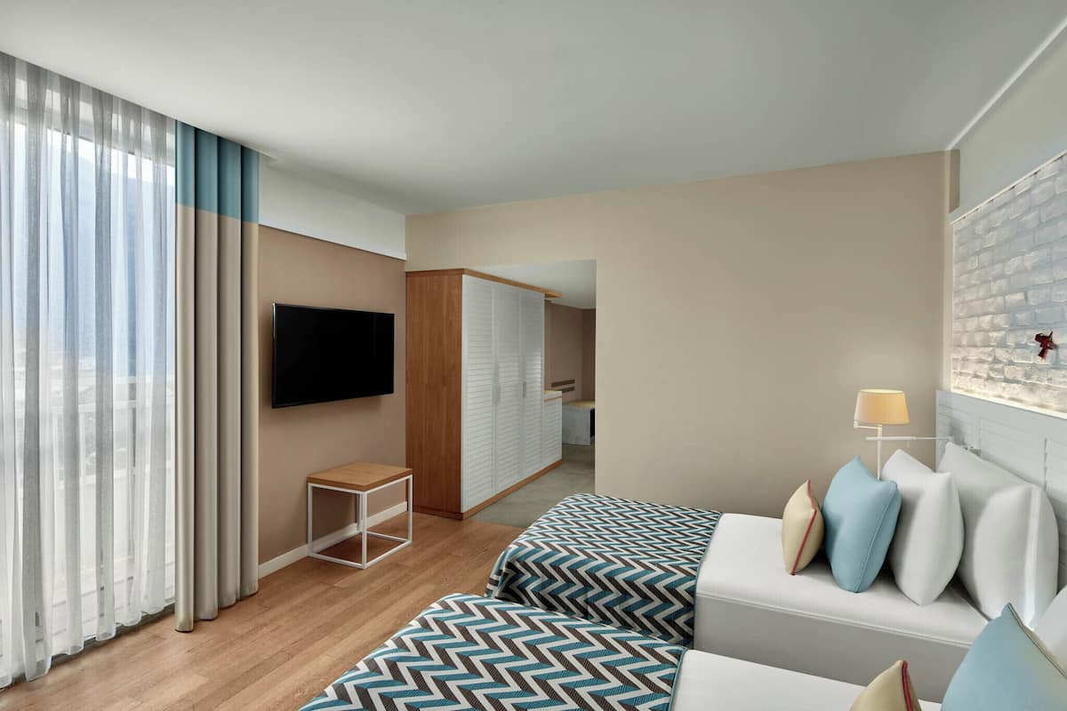 Family Room | Premium bedding, free minibar, in-room safe, desk