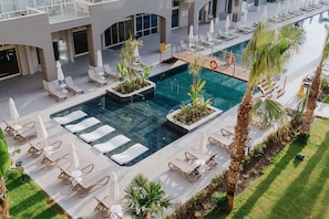 Indoor pool, seasonal outdoor pool, pool umbrellas, pool loungers