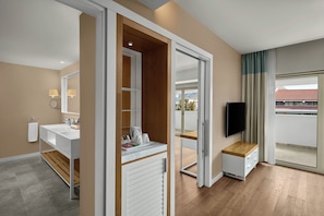 A modern bathroom with a double sink, vanity, and a mirror.