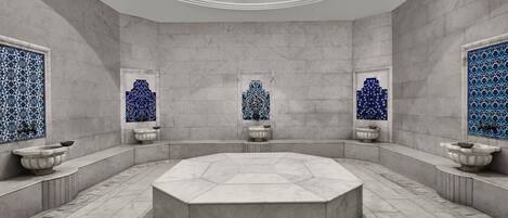 A spacious, octagonal-shaped room with a central seating area and three windows with blue patterned designs.