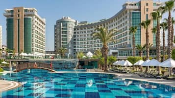 Indoor pool, 7 outdoor pools, open 7:00 AM to 7:00 PM, pool umbrellas