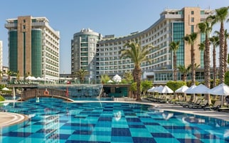 Indoor pool, 7 outdoor pools, open 7:00 AM to 7:00 PM, pool umbrellas