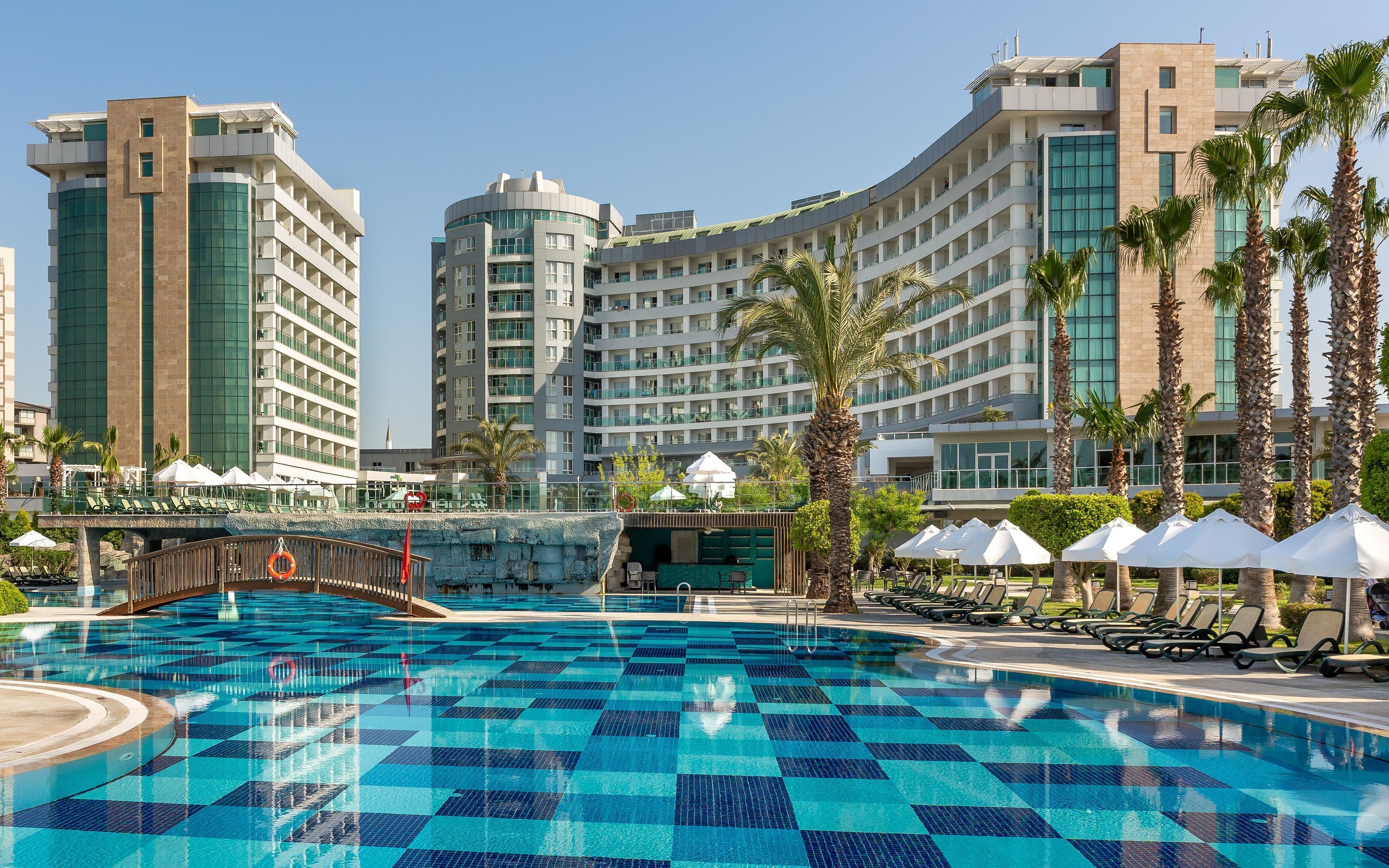 Indoor pool, 7 outdoor pools, open 7:00 AM to 7:00 PM, pool umbrellas