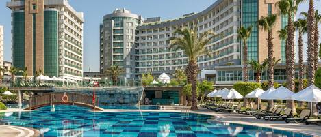 Indoor pool, 7 outdoor pools, open 7:00 AM to 7:00 PM, pool umbrellas