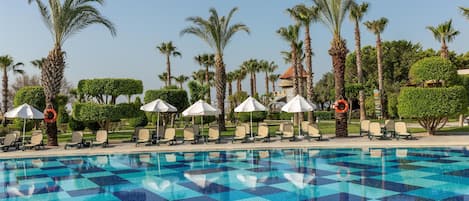 Indoor pool, 7 outdoor pools, open 7:00 AM to 7:00 PM, pool umbrellas