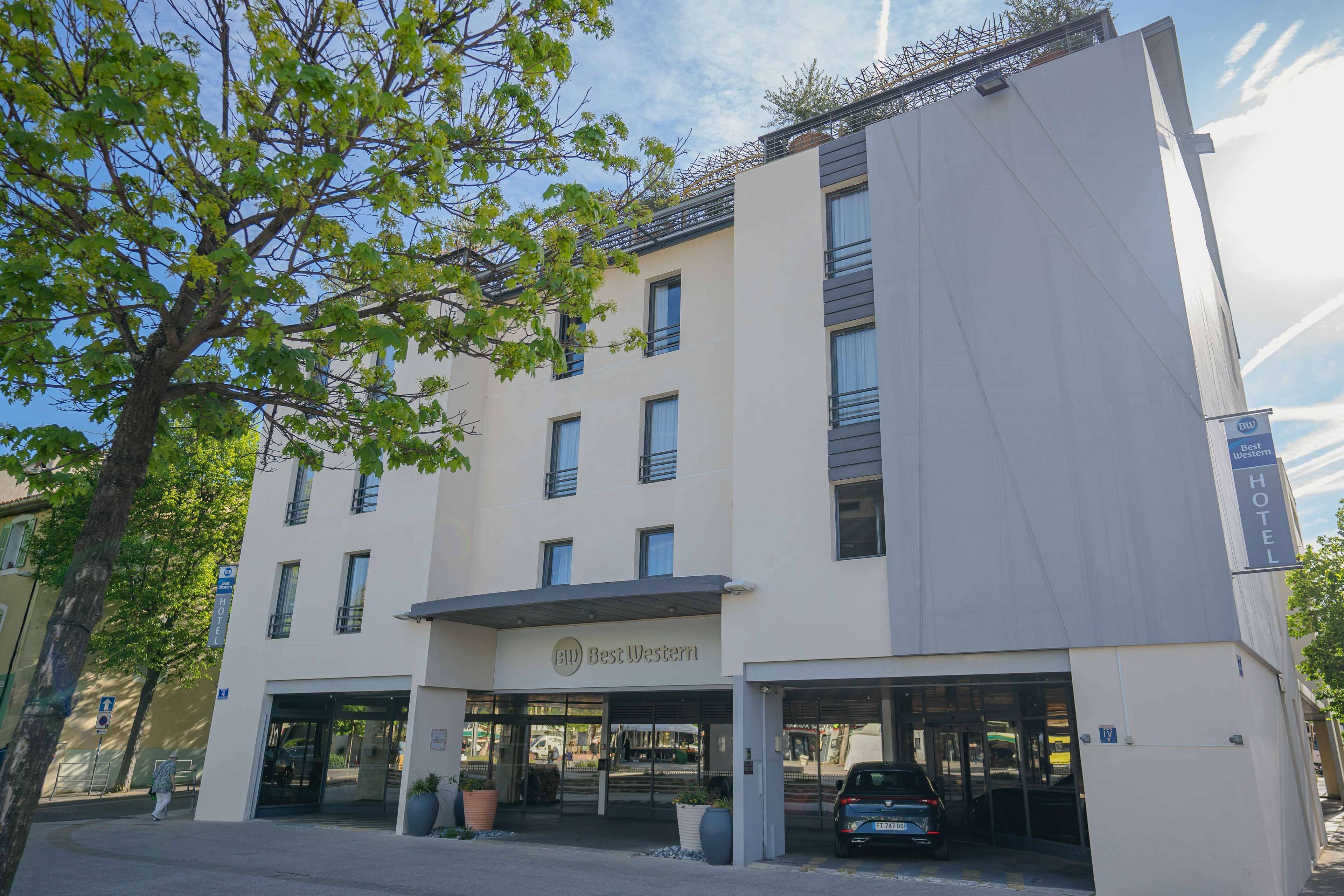 A modern hotel with a flat facade, multiple windows, and a clear entrance.