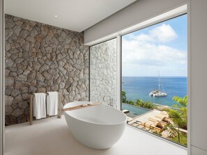 Designer toiletries, hair dryer, bathrobes, slippers